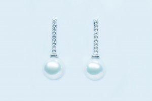white gold dangling earrings with akoya pearls and diamonds